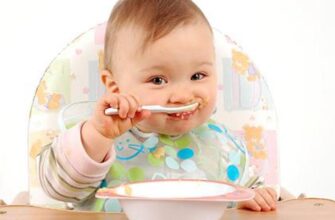baby eats with a spoon
